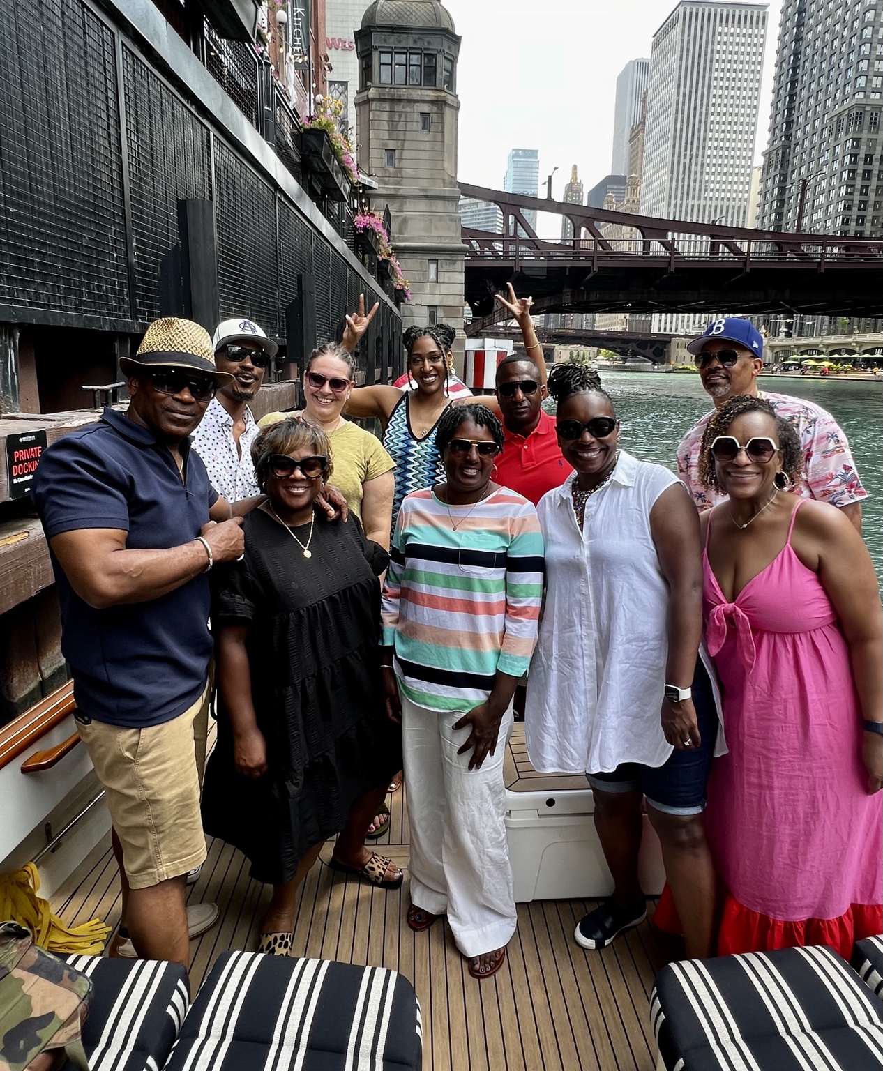 A group gathered on a boat along the Chicago River