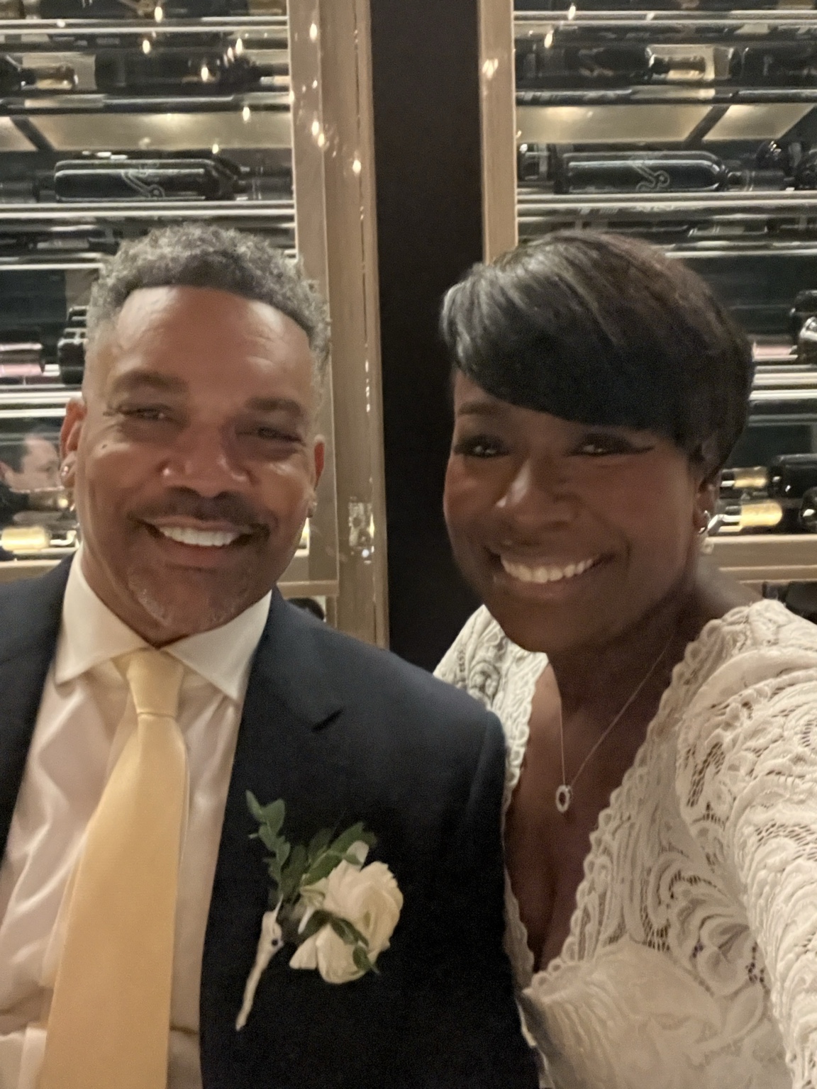 Two people smiling together in wedding attire